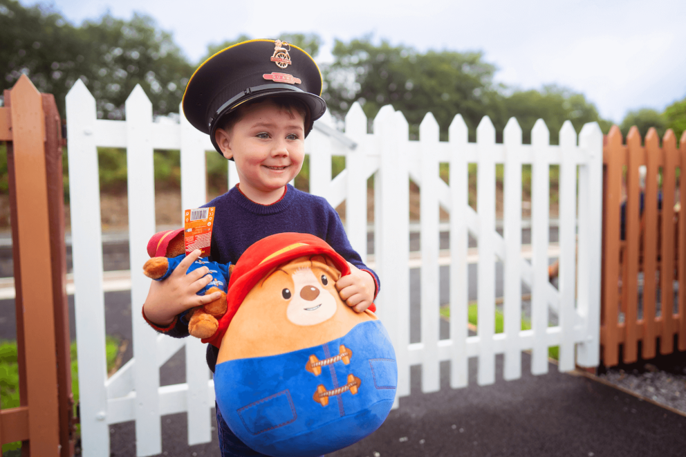 Boy with Paddington doll